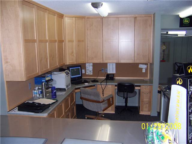 Maple computer desks with file drawers and upper storage cabinets. Farm implement dealer's office